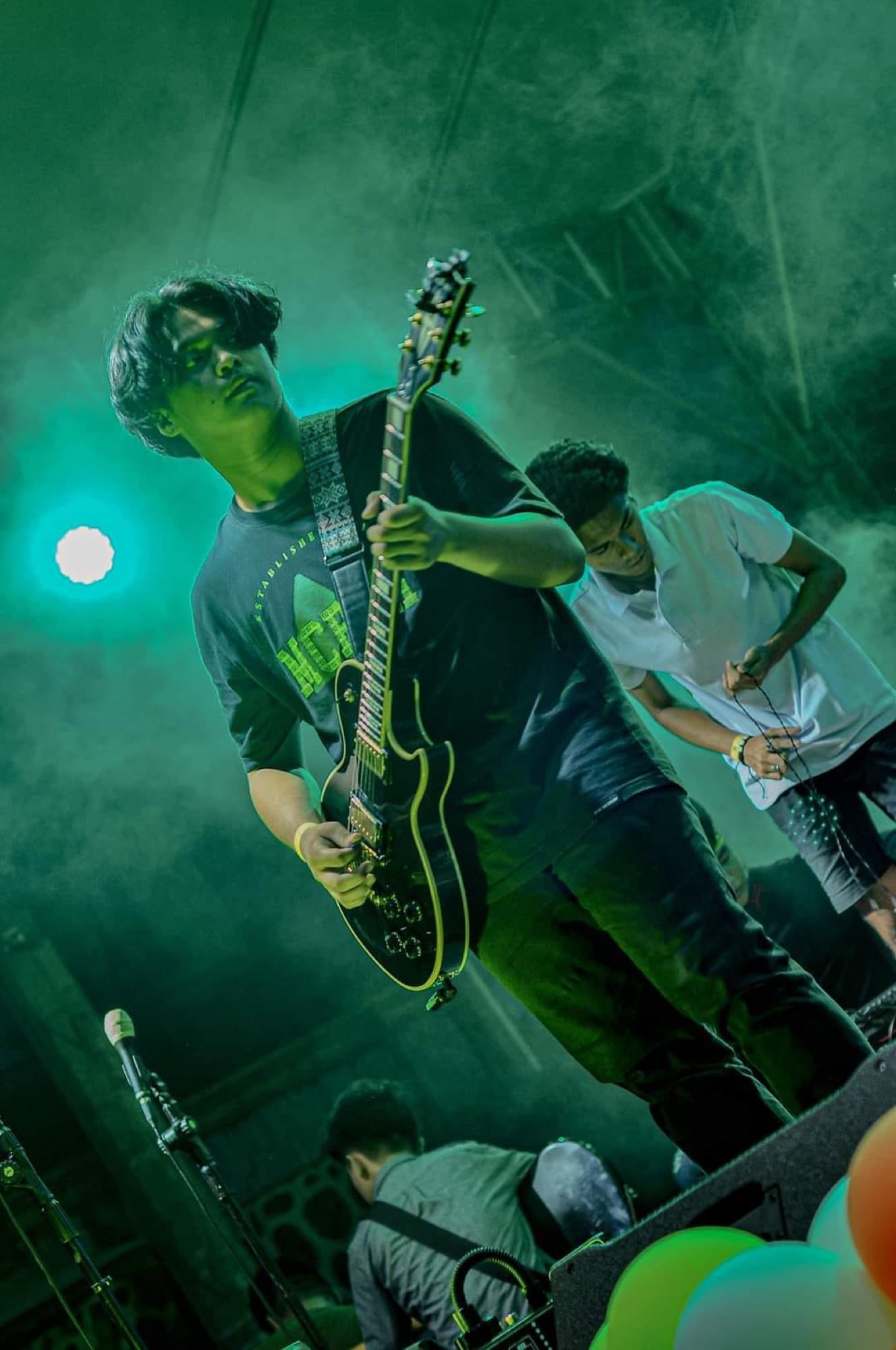 Performer under green stage light