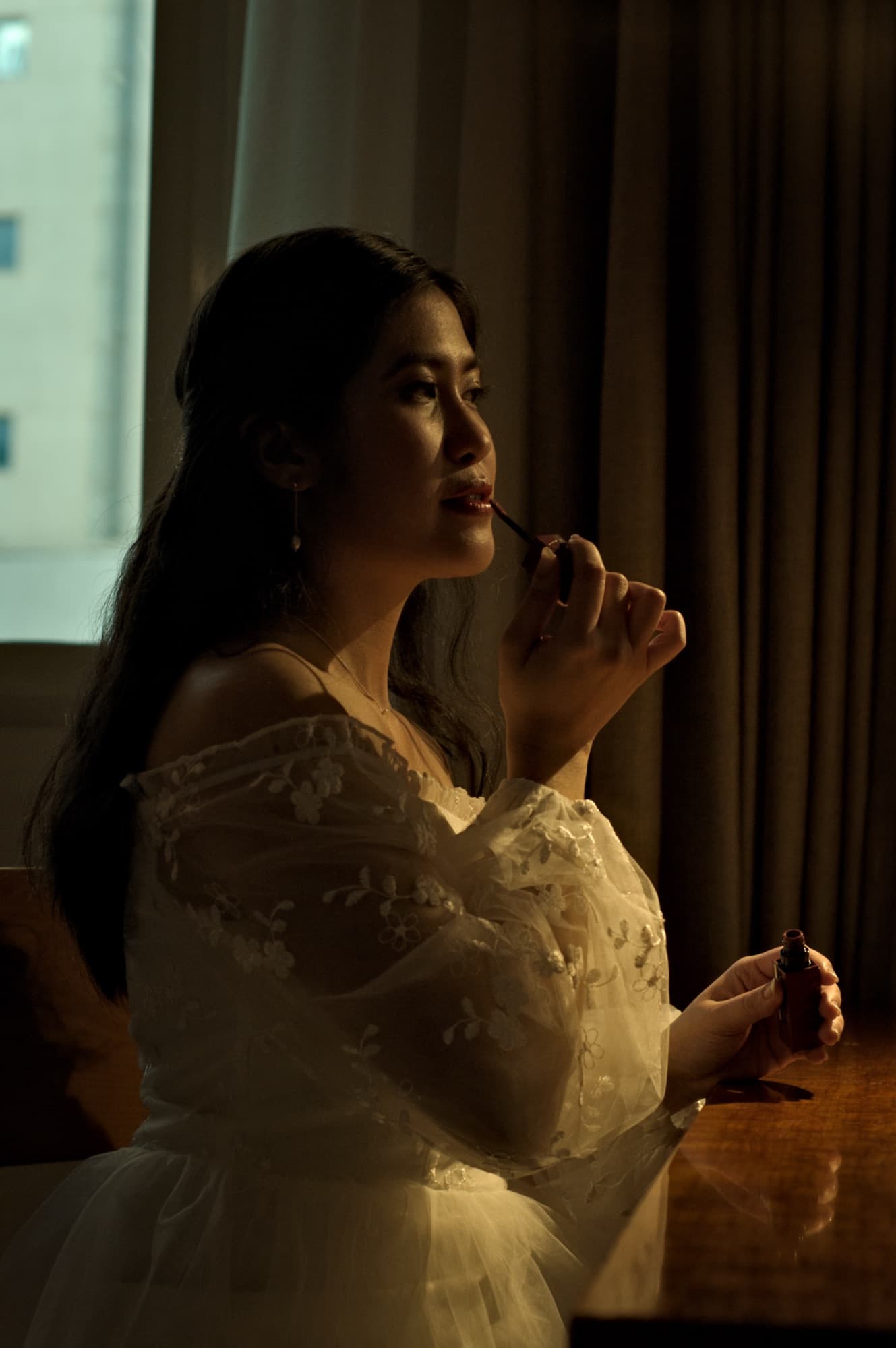 Bride in warm light before the ceremony