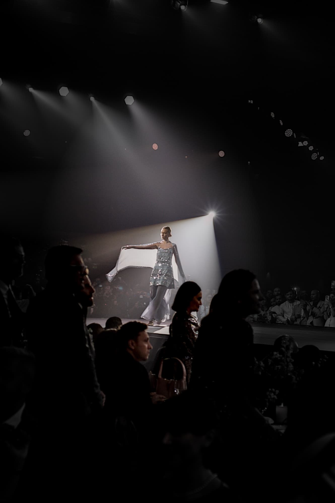 Final walk under stage lights at the Elle Residence fashion show