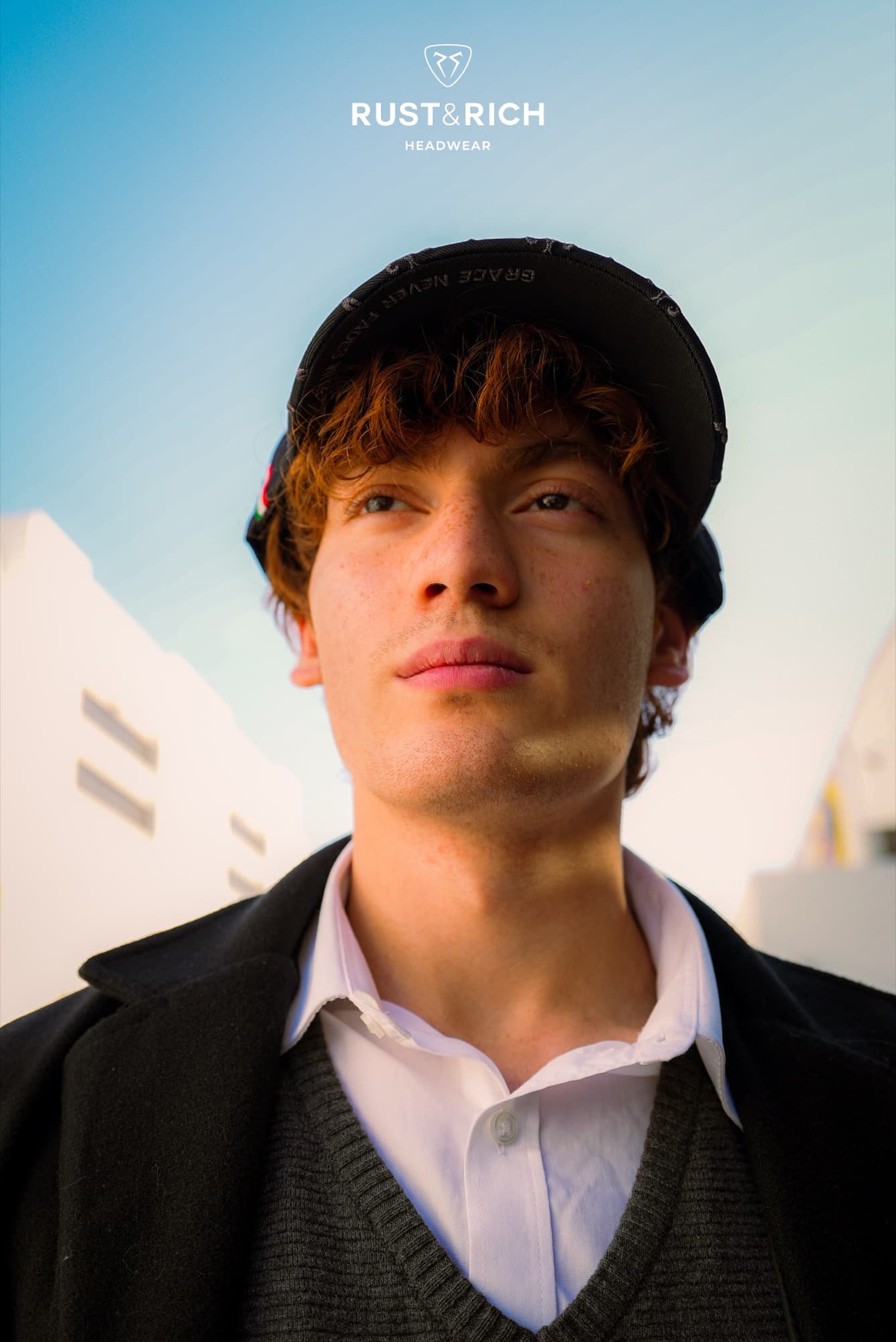 Rust and Rich campaign portrait in a black cap and coat